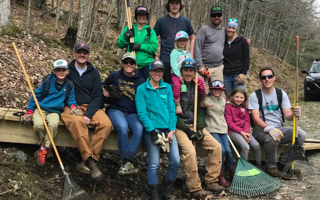 Volunteers gather for spring trails work day in Stowe Vermont.